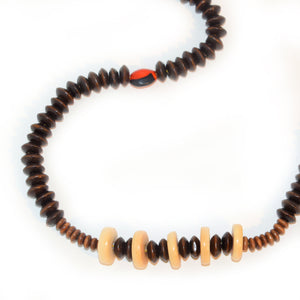 Carved tagua palm nut disks and wooden bead necklace