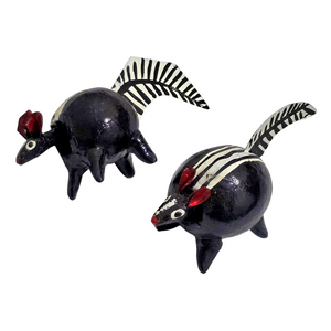 Bobble-head resin pig and skunk - made by an artisan from the Peruvian Amazon