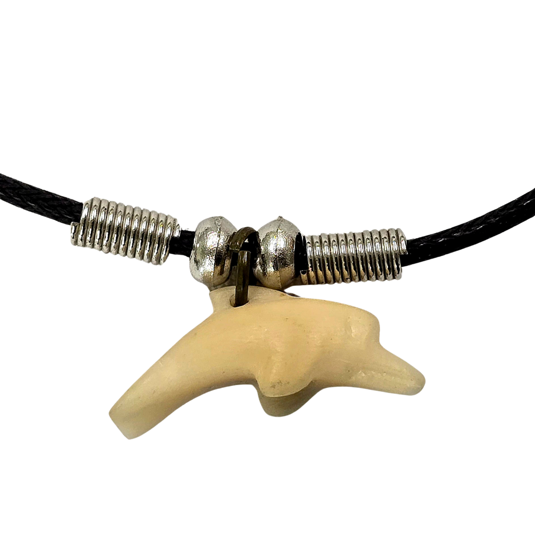 Carved tagua and palo sangre dolphin necklaces - made by artisans from the Peruvian Amazon