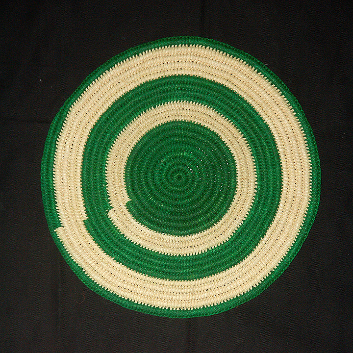 Woven hot pad (trivet) and center piece with green and white rings