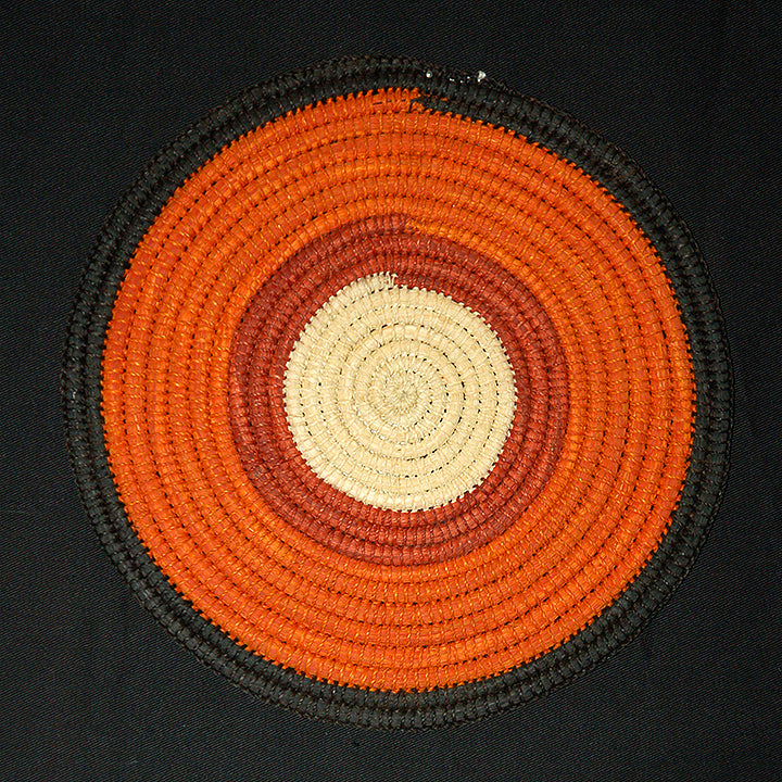 Woven hot pad (trivet) and center piece with earth-tone bands